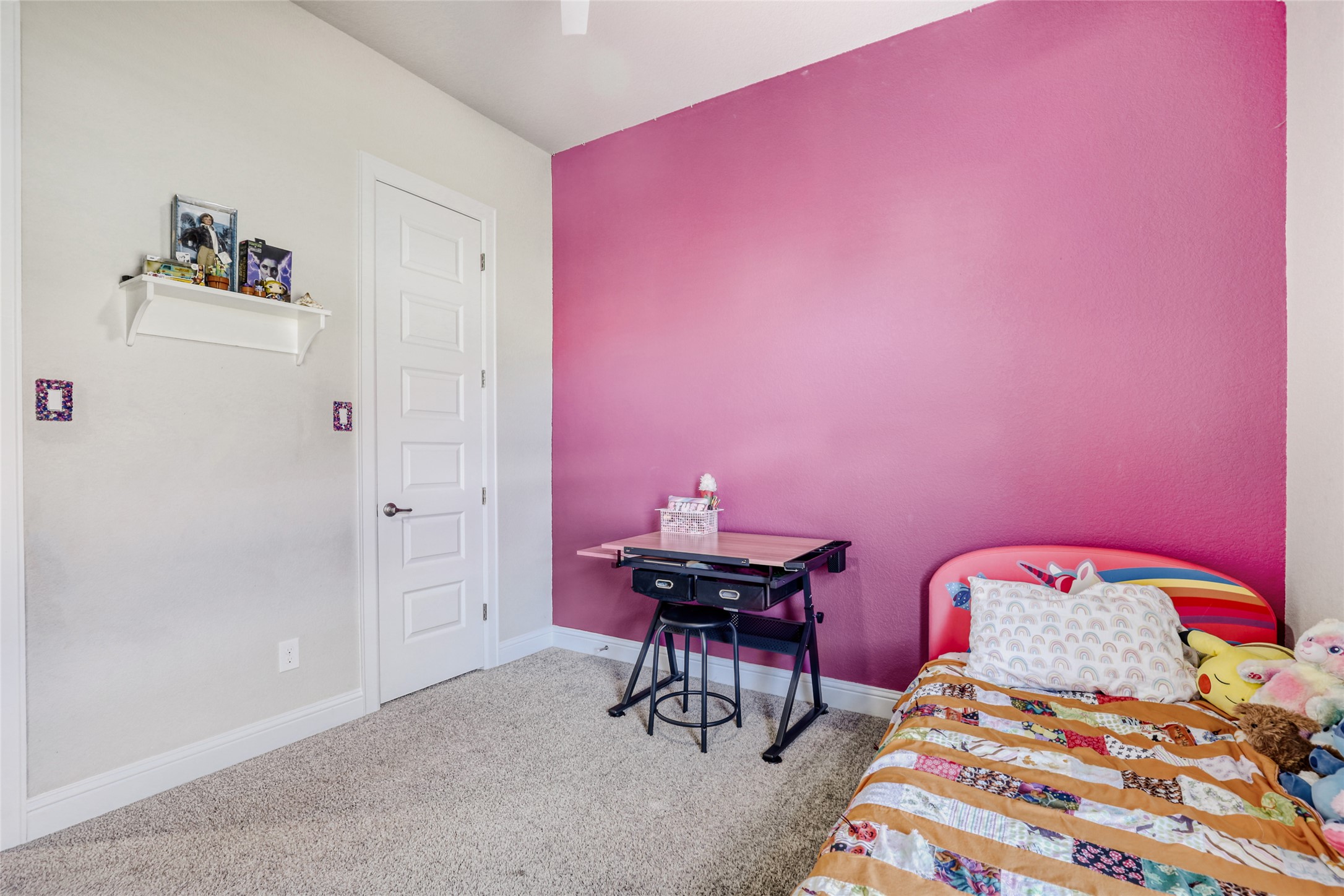 125 Buffalo View Lane Georgetown, TX 78628 - Photo 21 of 28 a bedroom with a bed and a desk