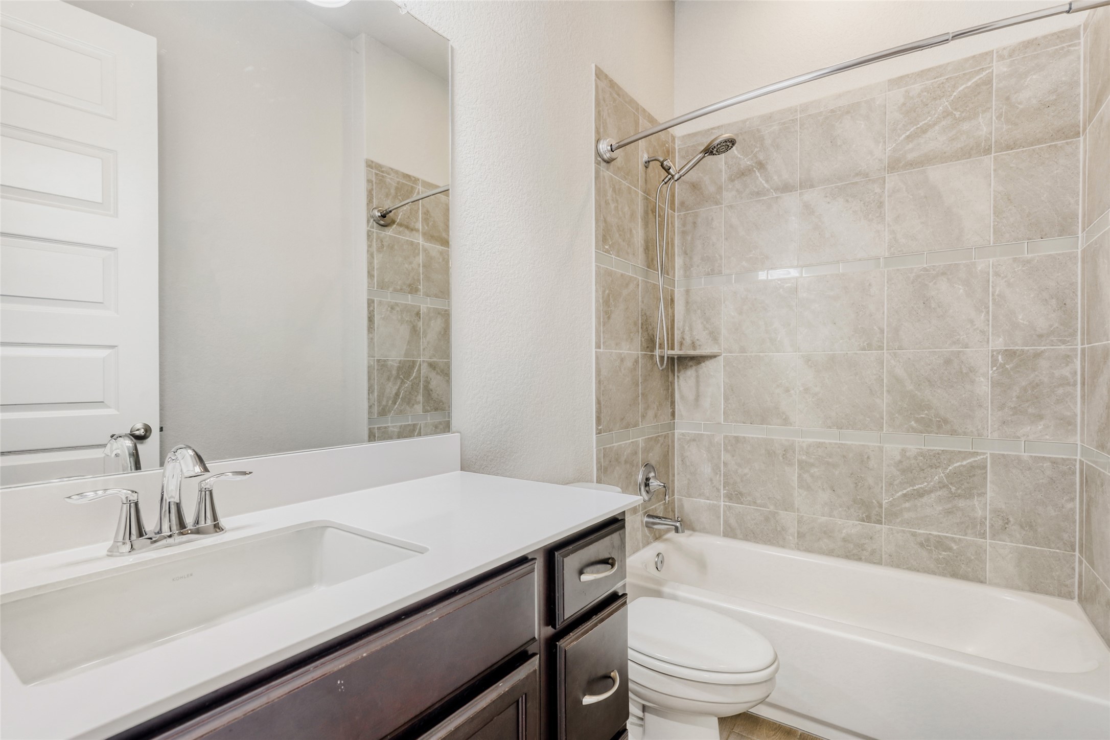125 Buffalo View Lane Georgetown, TX 78628 - Photo 23 of 28 a bathroom with a sink a toilet and a bathtub