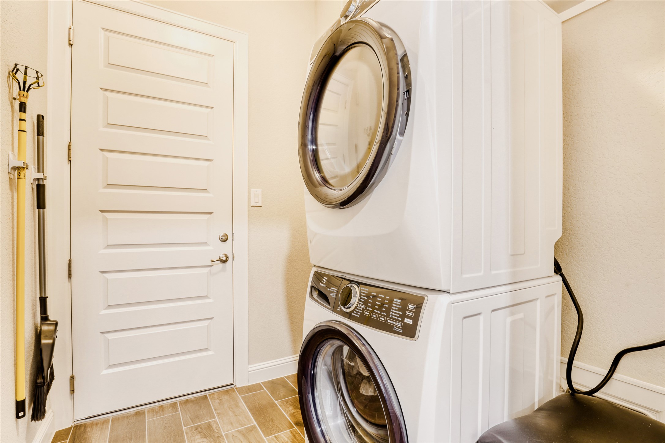 125 Buffalo View Lane Georgetown, TX 78628 - Photo 24 of 28 a view of a storage and utility room with washer and dryer