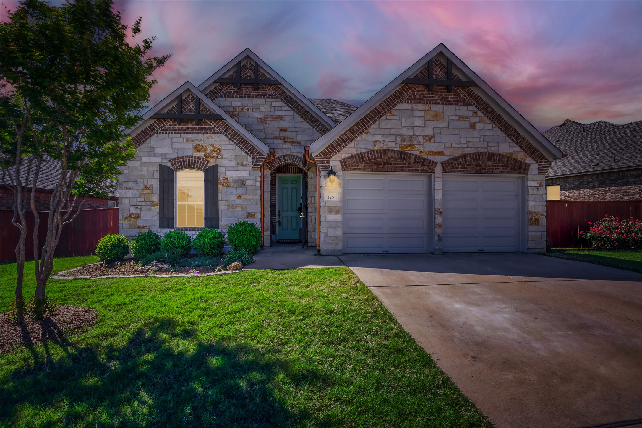 125 Buffalo View Lane Georgetown, TX 78628 - Photo 27 of 28 a front view of a house with a yard and garage