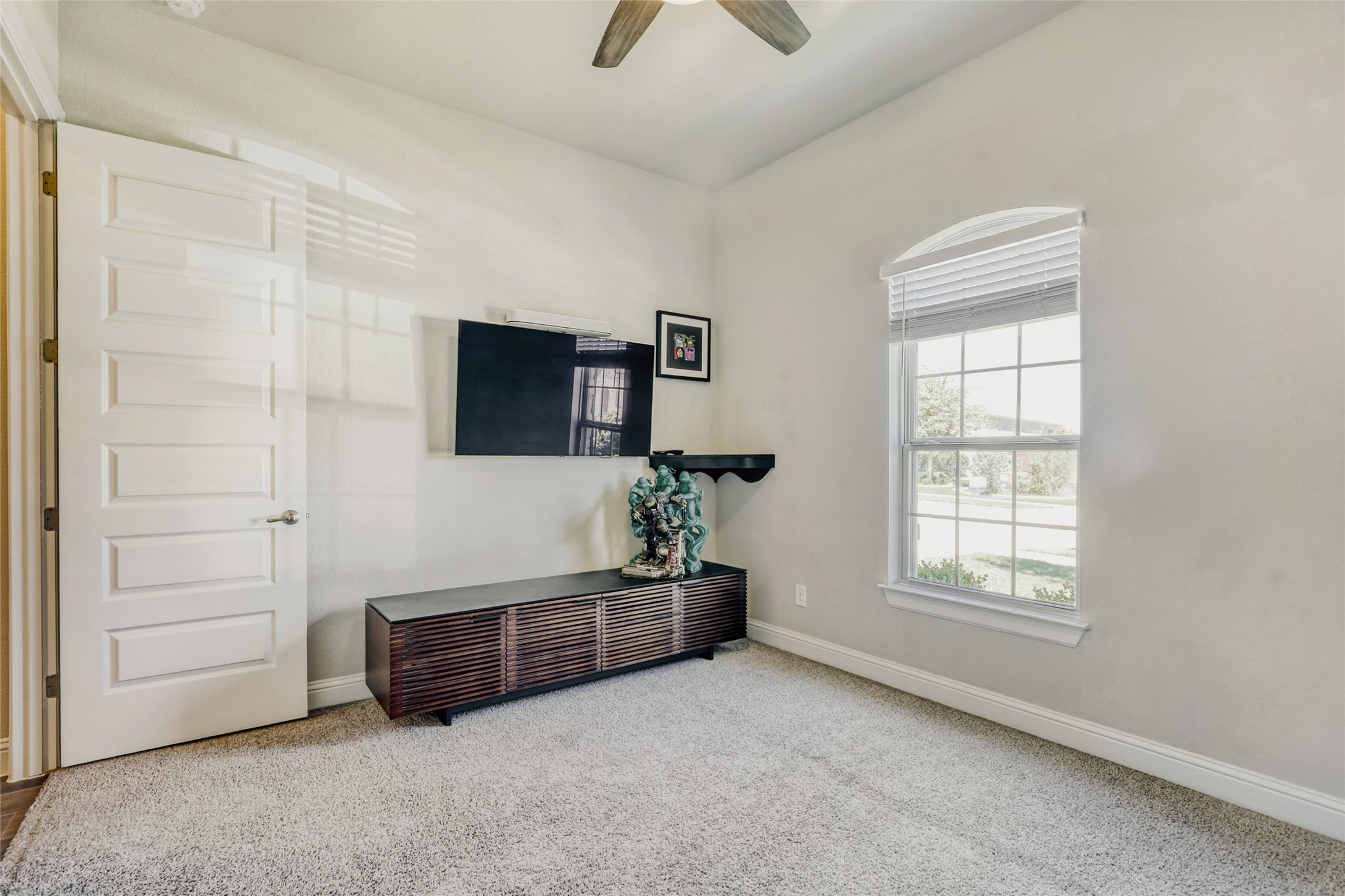 125 Buffalo View Lane Georgetown, TX 78628 - Photo 9 of 28 a living room with furniture and a flat screen tv