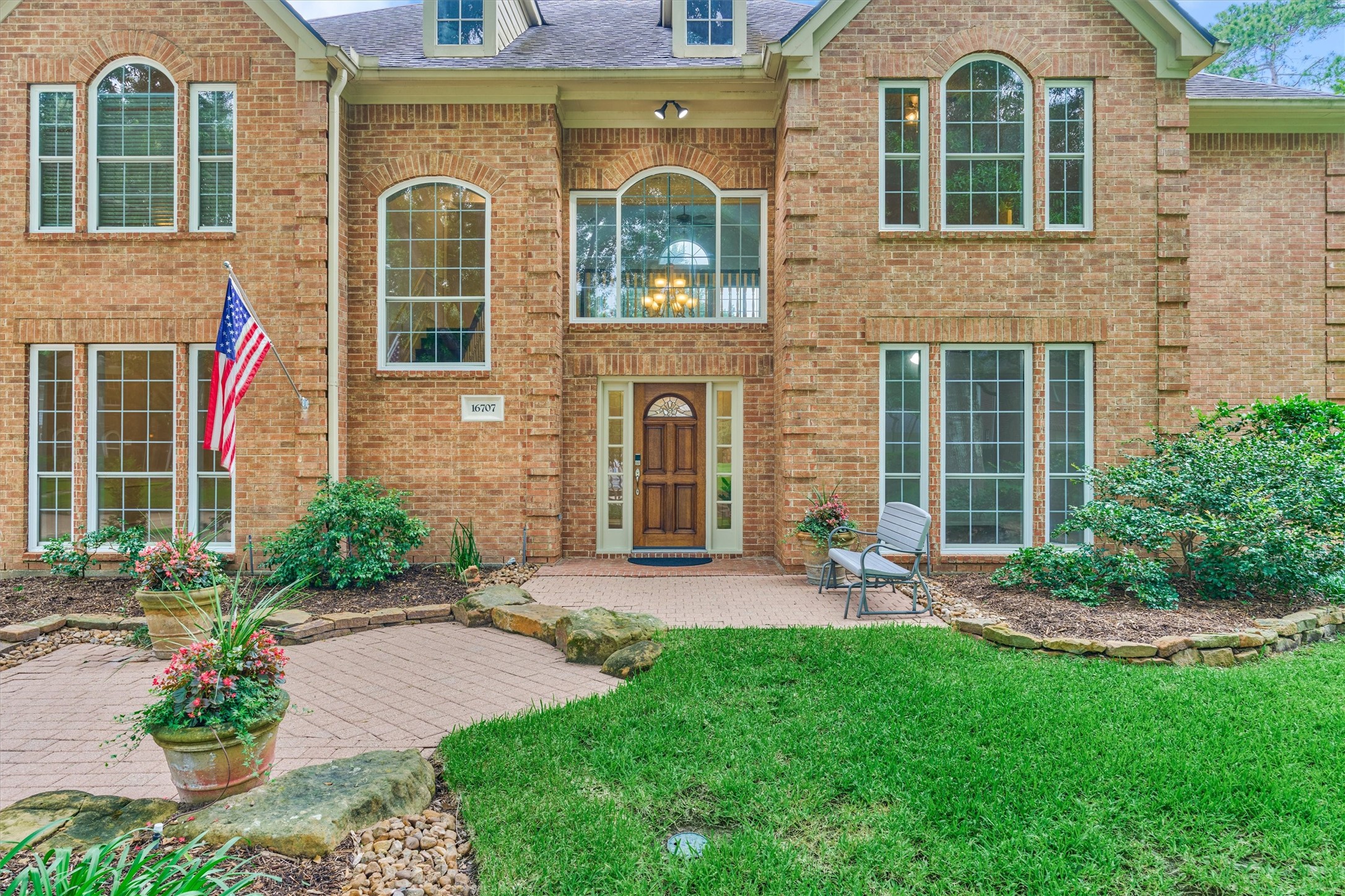 16707 Avenfield Road Tomball, TX 77377 - Photo 3 of 50 a front view of a house with garden and plants