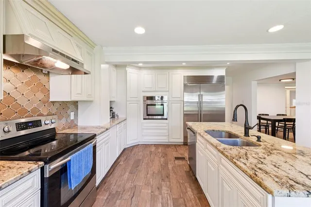 a bed room with a bed and a chandelier