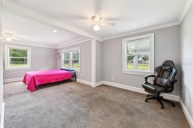 a view of a livingroom with wooden floor and door