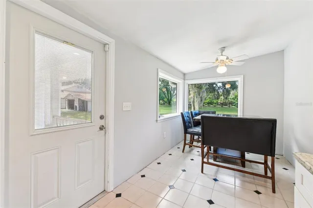 a spacious bedroom with a bed and a chandelier