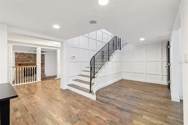 a view of staircase with white walls and a window