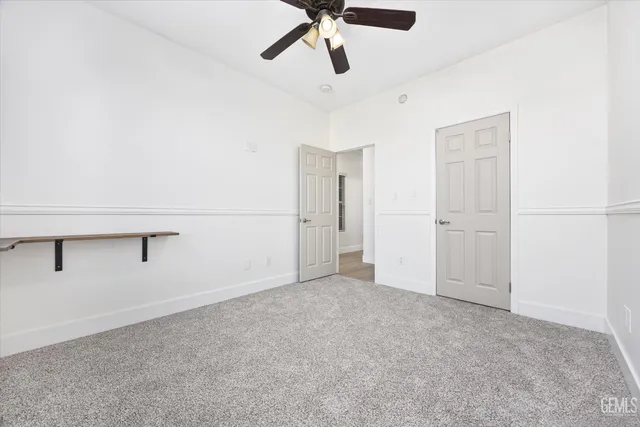 a kitchen with granite countertop a sink and cabinets