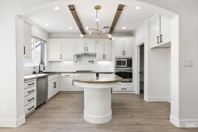 a close view of a stove top oven sitting inside of a kitchen