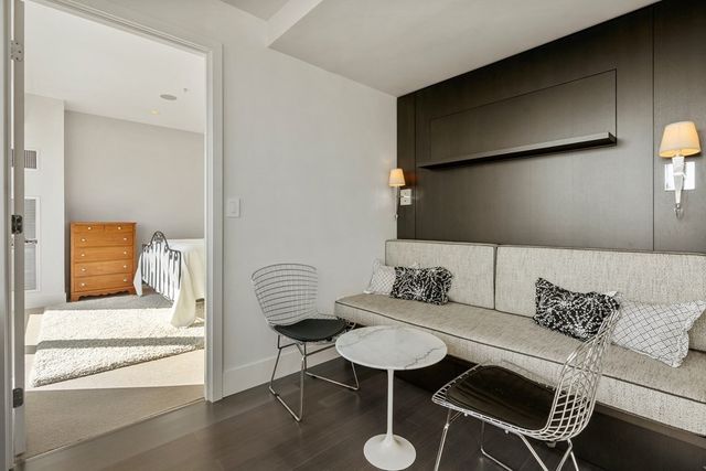 a living room with furniture and a rug