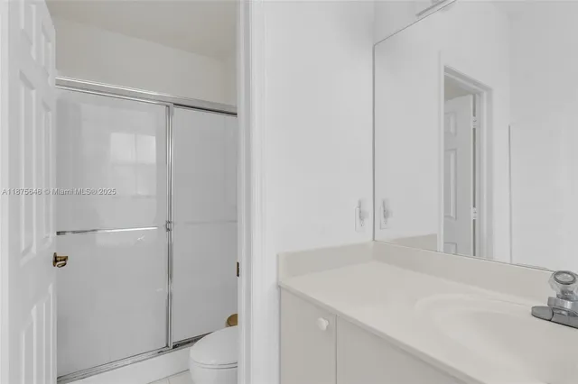 a bathroom with a sink and vanity