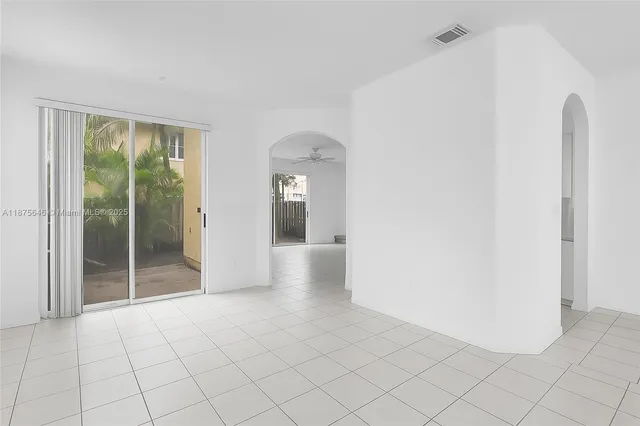 a view of an empty room and window