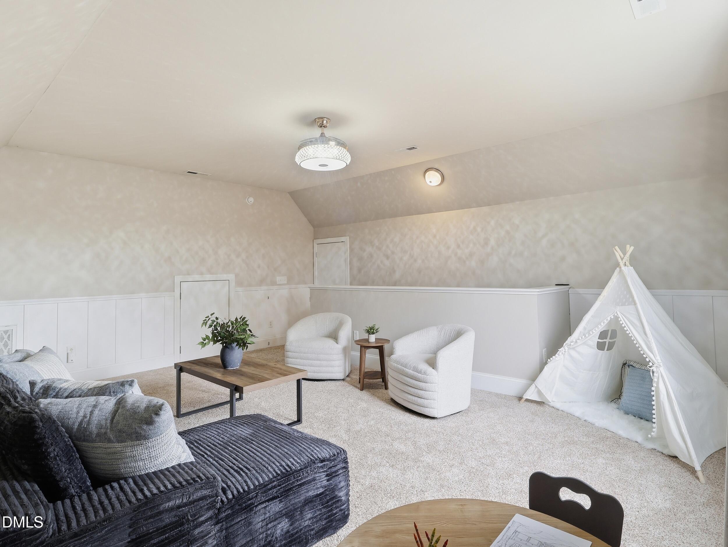 208 Brookberry Road Holly Springs, NC 27540 - Photo 19 of 32 a living room with furniture and a couch