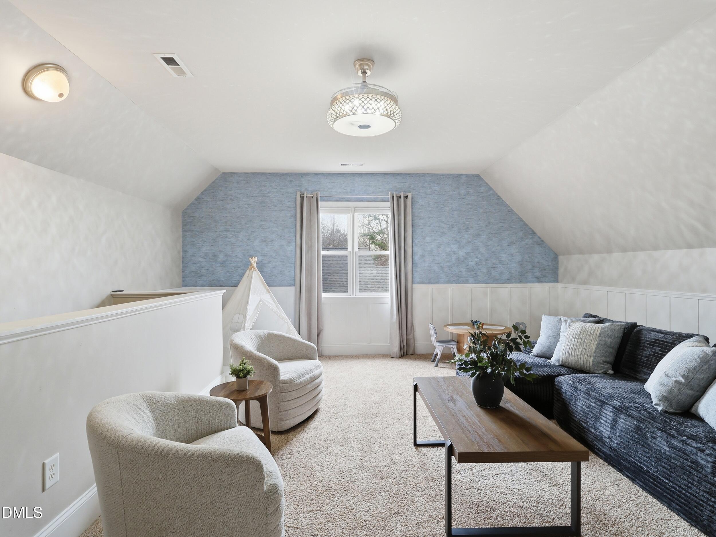 208 Brookberry Road Holly Springs, NC 27540 - Photo 20 of 32 a living room with furniture and a large window