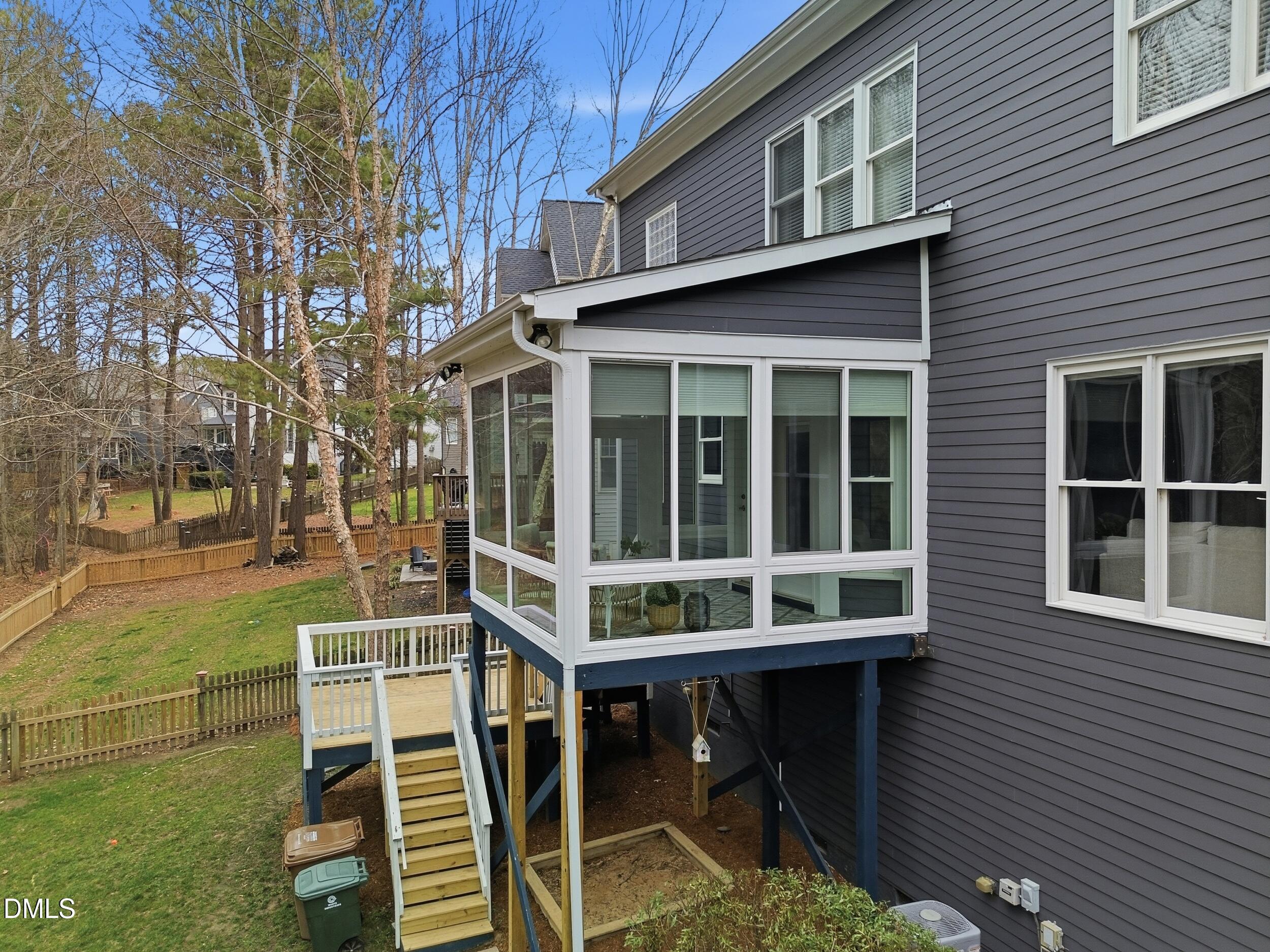 208 Brookberry Road Holly Springs, NC 27540 - Photo 21 of 32 a view of a house with backyard porch and sitting area