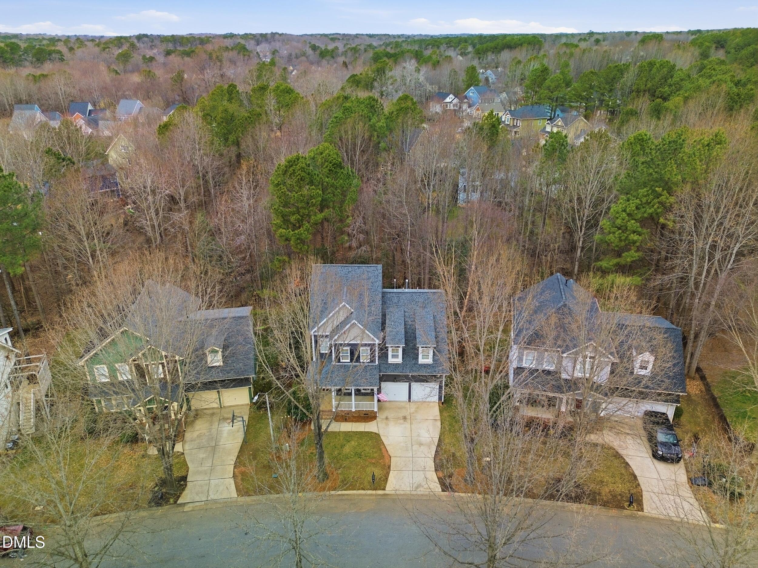 208 Brookberry Road Holly Springs, NC 27540 - Photo 22 of 32 an aerial view of residential houses with outdoor space and trees