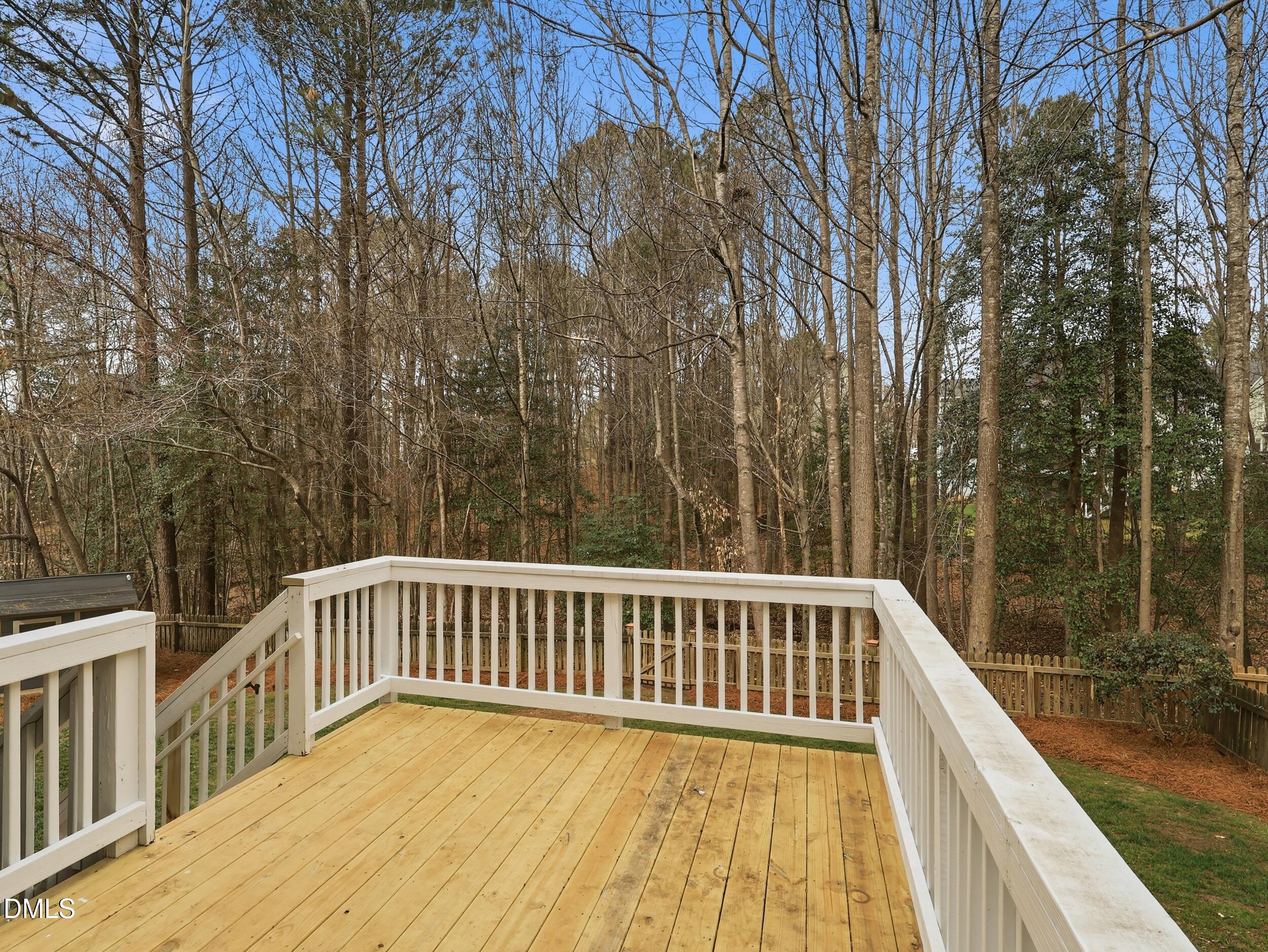 208 Brookberry Road Holly Springs, NC 27540 - Photo 23 of 32 a view of balcony with wooden floor and fence