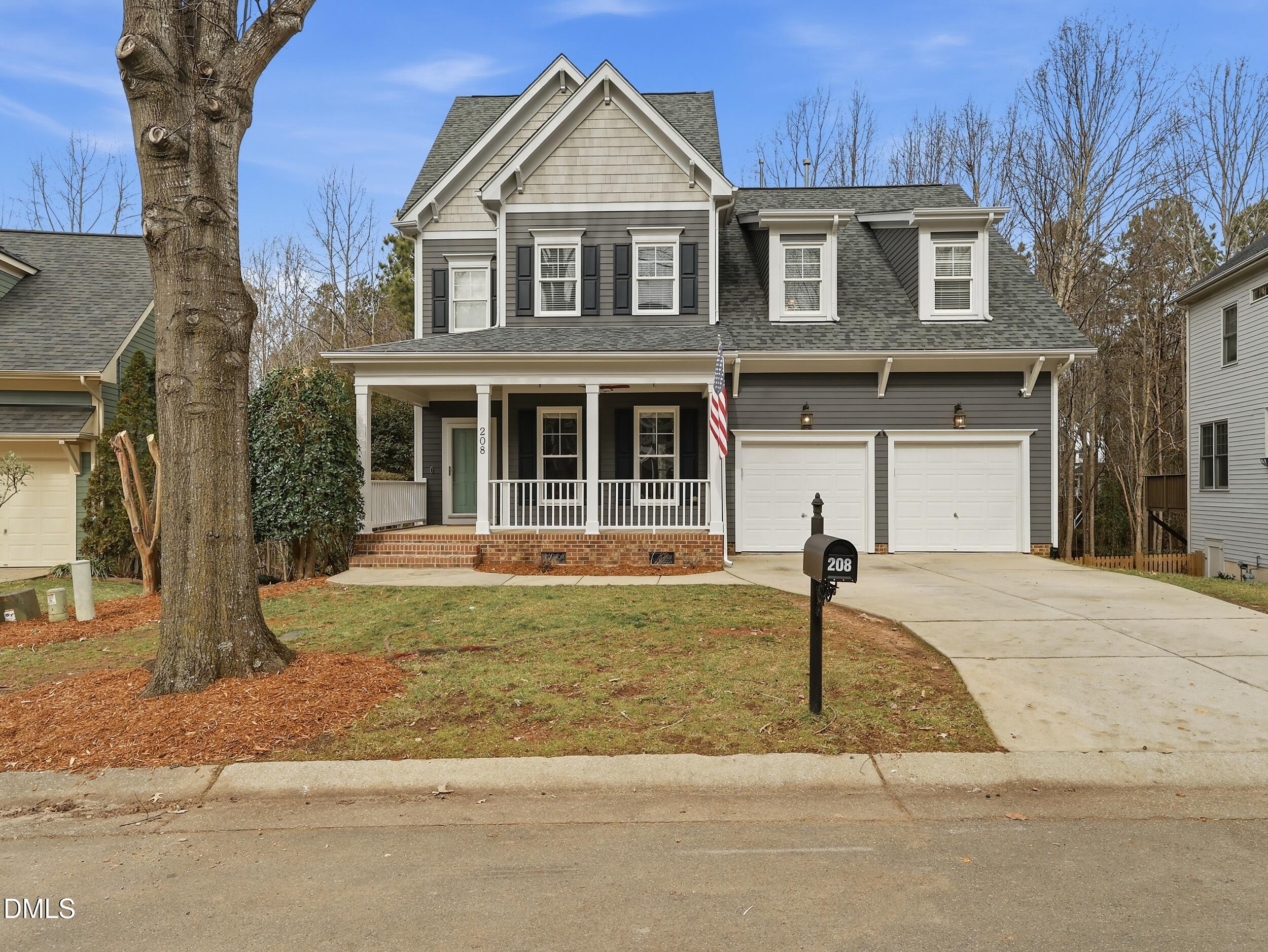 208 Brookberry Road Holly Springs, NC 27540 - Photo 24 of 32 a front view of a house with a yard