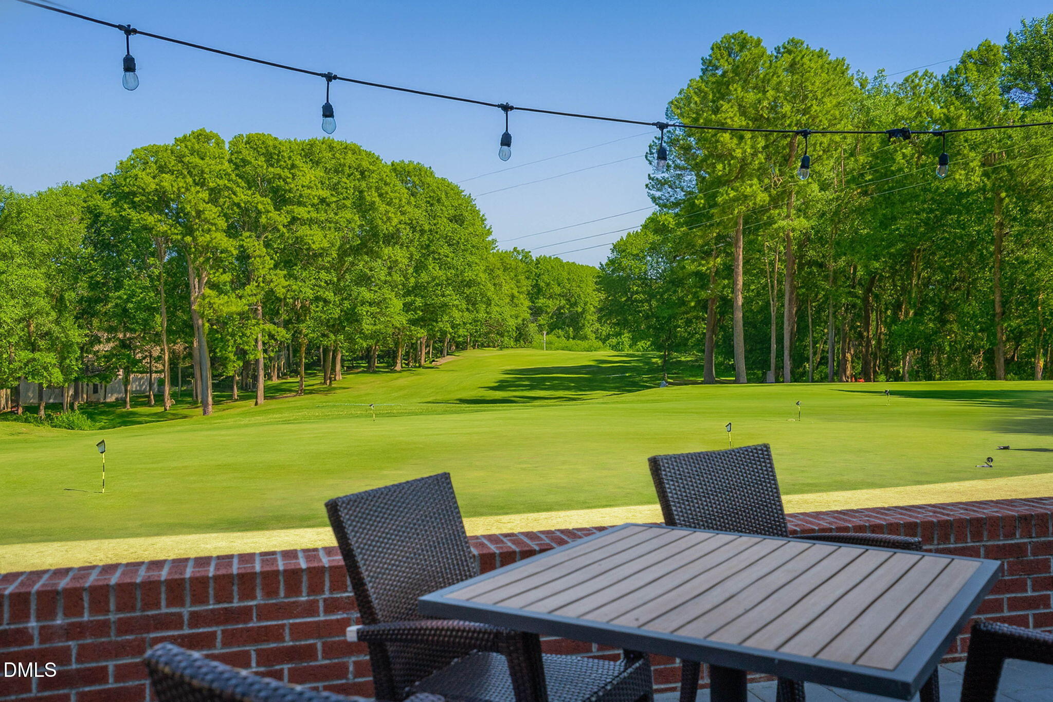 208 Brookberry Road Holly Springs, NC 27540 - Photo 30 of 32 a view of a chairs and table on the patio