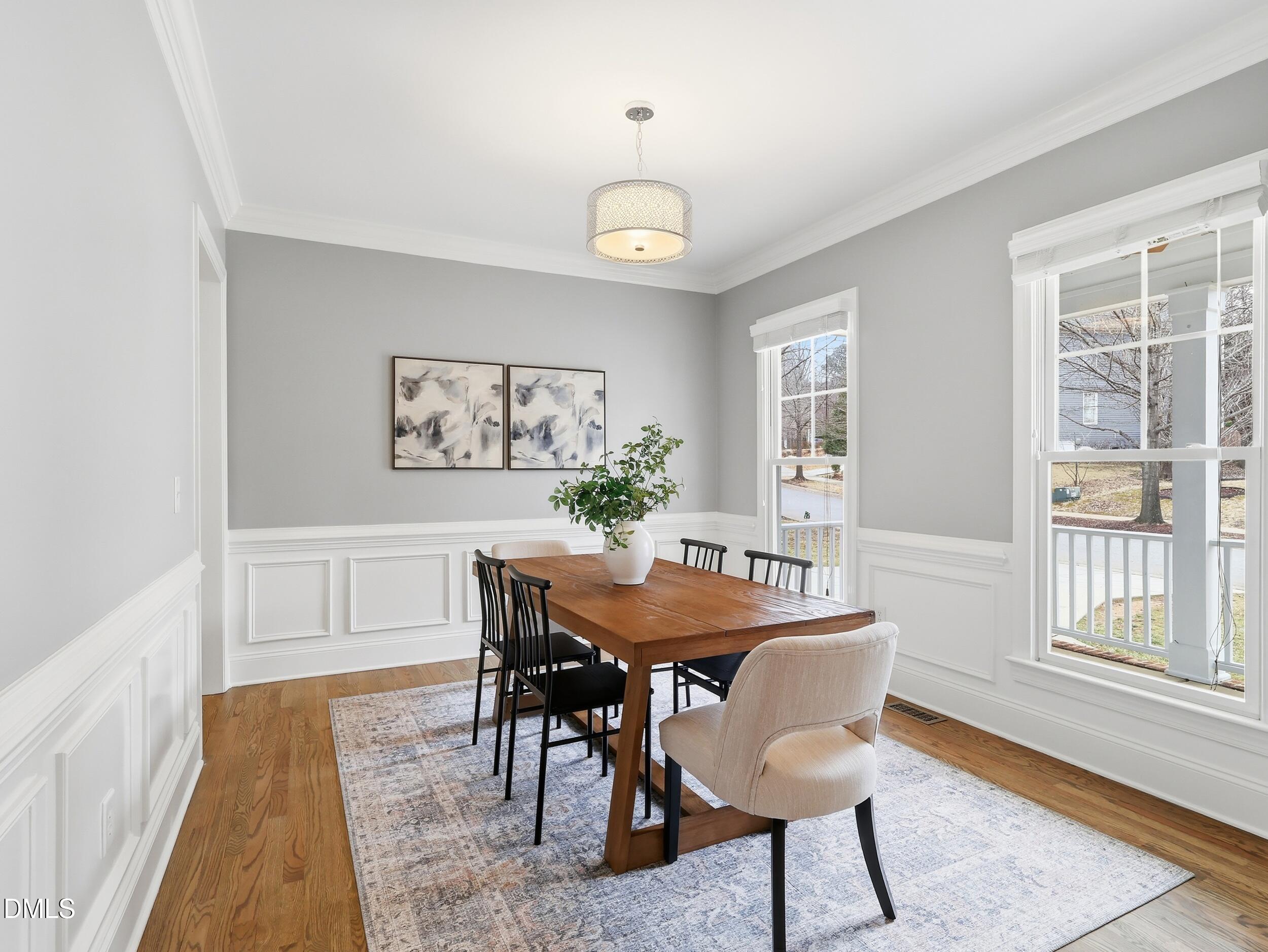 208 Brookberry Road Holly Springs, NC 27540 - Photo 4 of 32 a view of a dining room with furniture window and wooden floor
