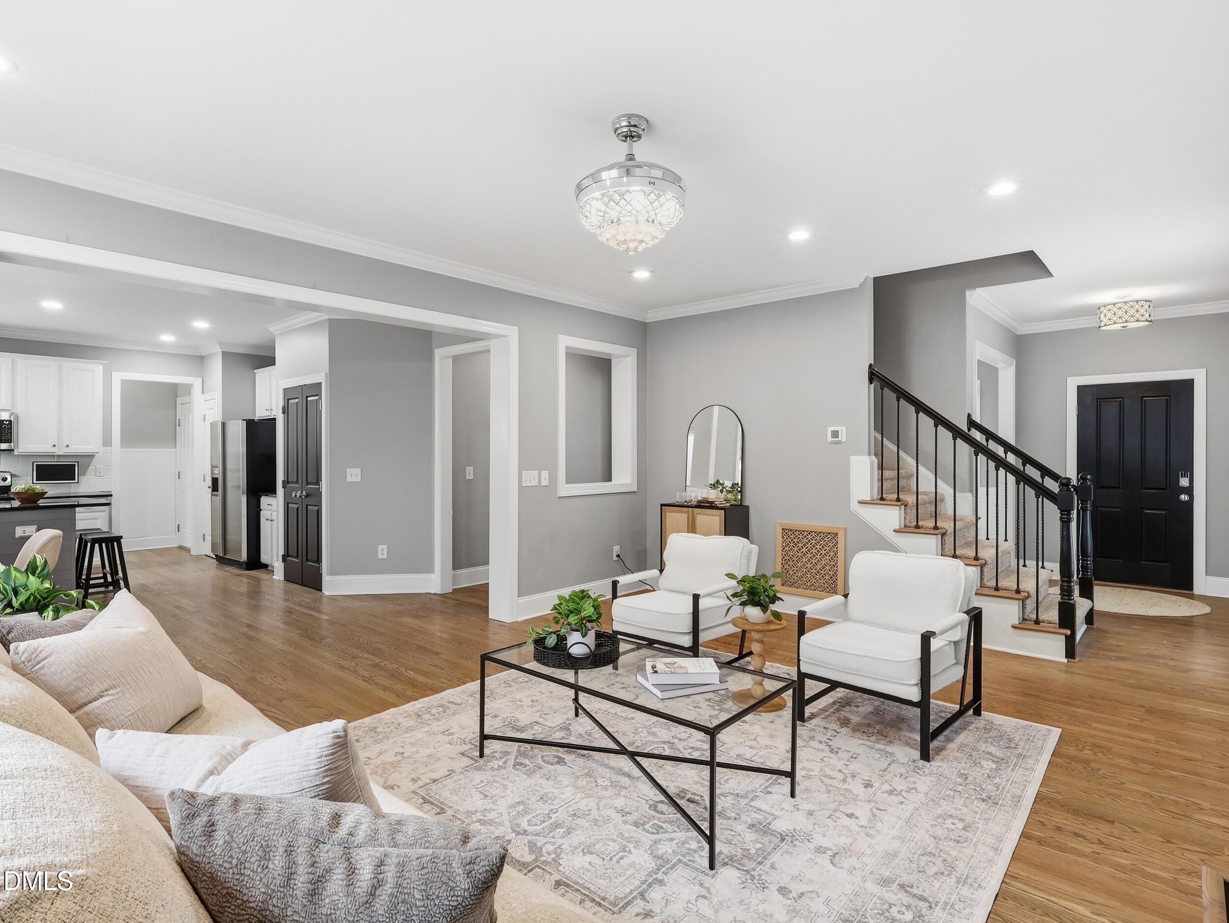 208 Brookberry Road Holly Springs, NC 27540 - Photo 6 of 32 a living room with furniture and wooden floor