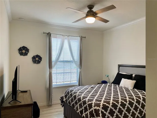 a bathroom with a granite countertop sink a toilet and a mirror