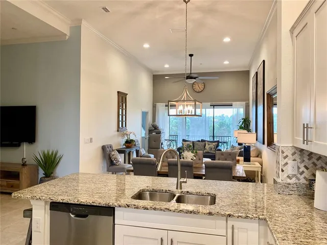 a kitchen with sink cabinets and window