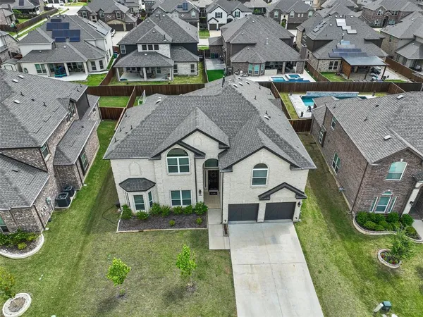 a aerial view of a house with a yard