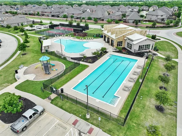 an aerial view of a house with outdoor space