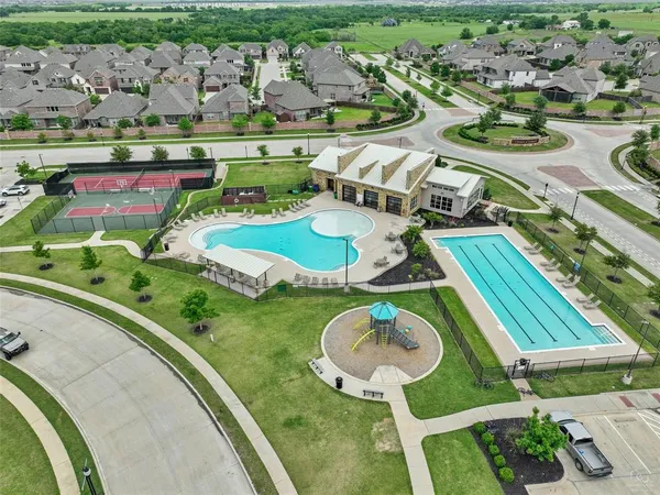 an aerial view of a swimming pool and outdoor space