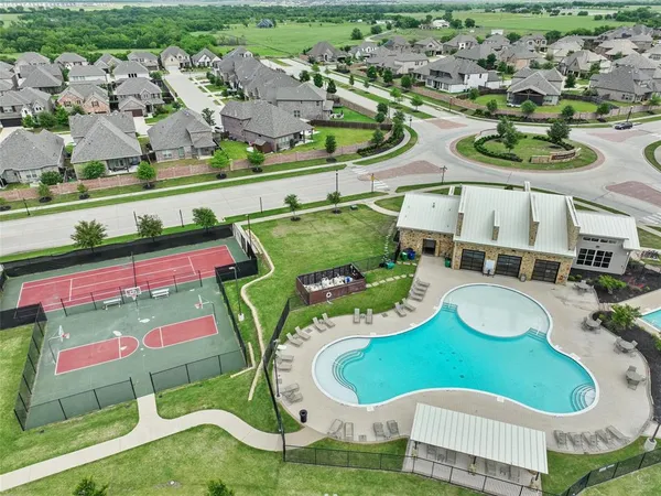 an aerial view of a swimming pool and outdoor space