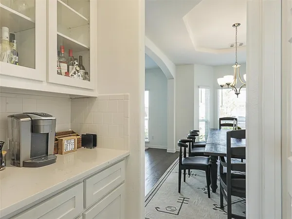 a kitchen with a table and chairs