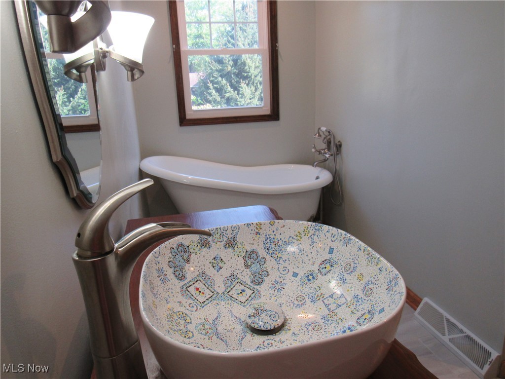 1120 Vincent Road Southeast North Canton, OH 44720 - Photo 26 of 50 Bathroom featuring a healthy amount of sunlight