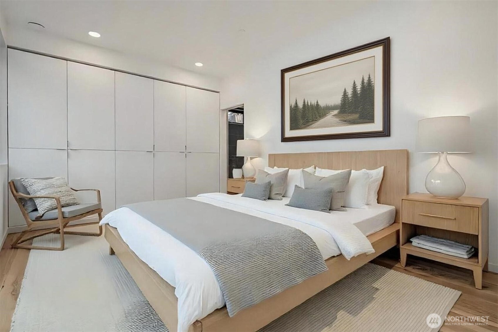 230 Canopy Path Northwest Bainbridge Island, WA 98110 - Photo 18 of 39 a bedroom with a bed and a painting on the wall