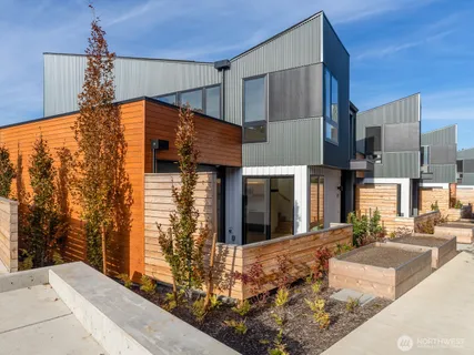 a backyard of a house with yard and outdoor seating
