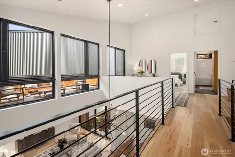 a living room with furniture and a book shelf