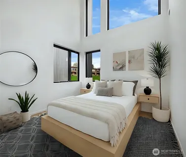 a bedroom with bed and a table