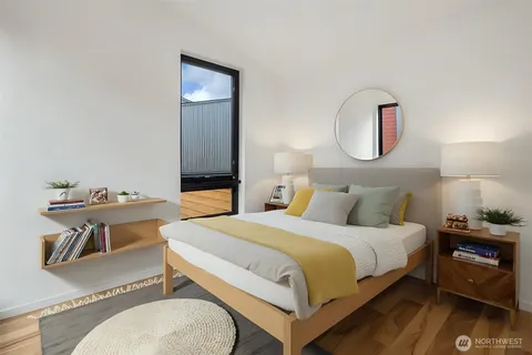 a view of a patio with a table and chairs under an umbrella