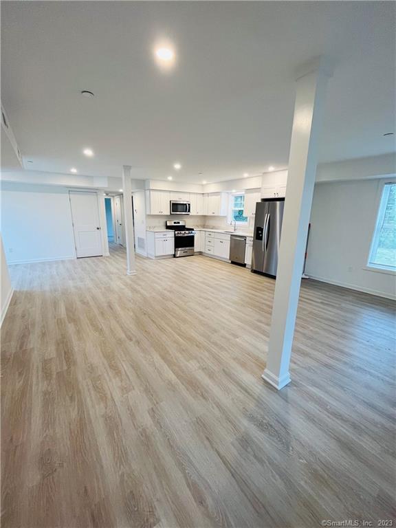 54 School Street Bridgeport, CT 06605 - Photo 2 of 9 a large room with lots of counter space and mirrors