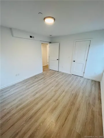 a bathroom with 2 sink toilet and a mirror