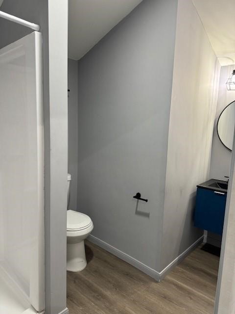 4049 Lucille Street, Unit C Houston, TX 77026 - Photo 11 of 13 a bathroom with a granite countertop toilet and a sink