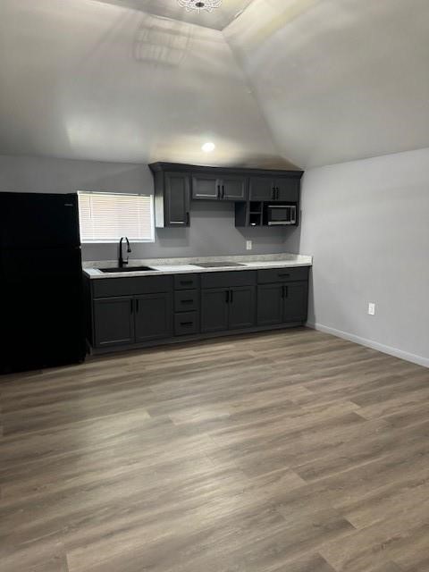 4049 Lucille Street, Unit C Houston, TX 77026 - Photo 5 of 13 a large kitchen with stainless steel appliances granite countertop a large counter top and a stove with wooden floor