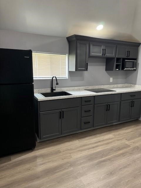 4049 Lucille Street, Unit C Houston, TX 77026 - Photo 6 of 13 a kitchen with stainless steel appliances granite countertop a sink stove and refrigerator