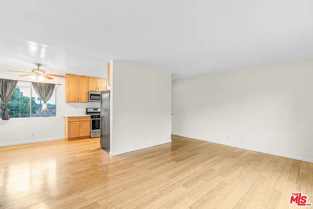 a view of a kitchen with a stove top oven