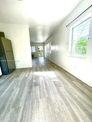 a bathroom with a sink a mirror a toilet and vanity