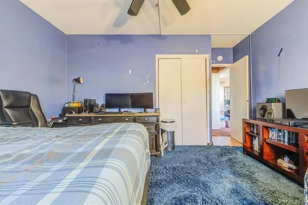 a room with a bed and a chandelier