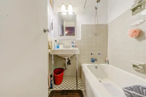 a white toilet sitting next to a bathroom sink