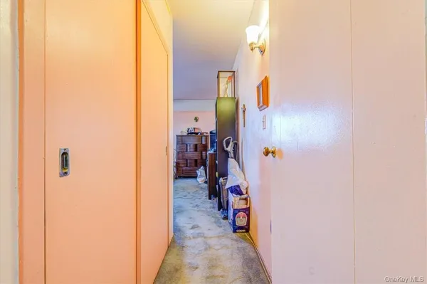 a reading room with furniture and a potted plant