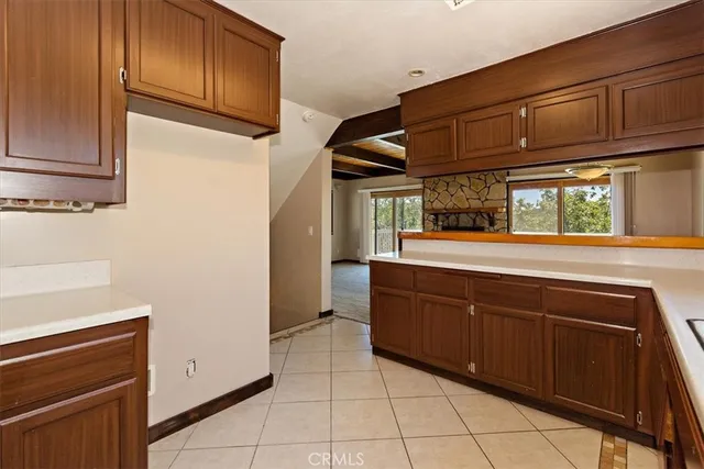 a kitchen with stainless steel appliances granite countertop a refrigerator and cabinets