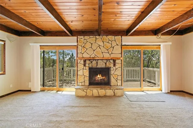 a view of an empty room with a fireplace