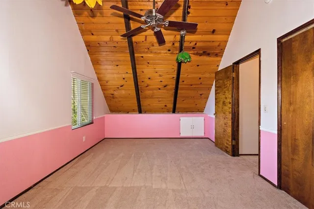 a view of a balcony with wooden floor